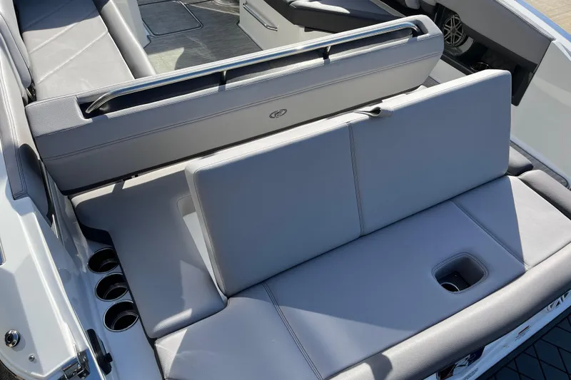 Slide: The Image of 2022 Cobalt R8 boat interior with gray seating and cup holders. - 9