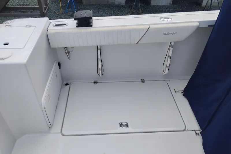 Slide: The Image of 2007 Glacier Bay 2685 Coastal Runner boat interior with storage compartments. - 10
