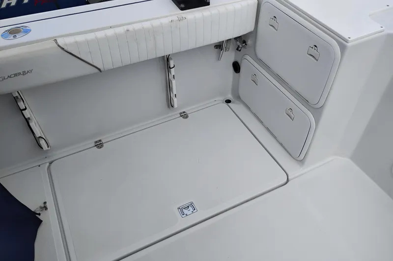 Slide: The Image of 2007 Glacier Bay 2685 Coastal Runner boat interior with storage compartments. - 12
