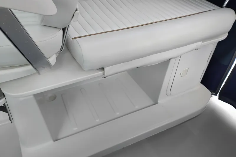 Slide: The Image of 2007 Glacier Bay 2685 Coastal Runner interior seating and storage compartment. - 16