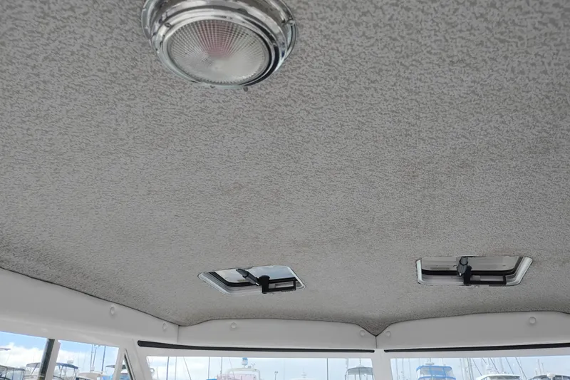 Slide: The Image of Ceiling view of 2007 Glacier Bay 2685 Coastal Runner boat interior with light fixtures. - 18