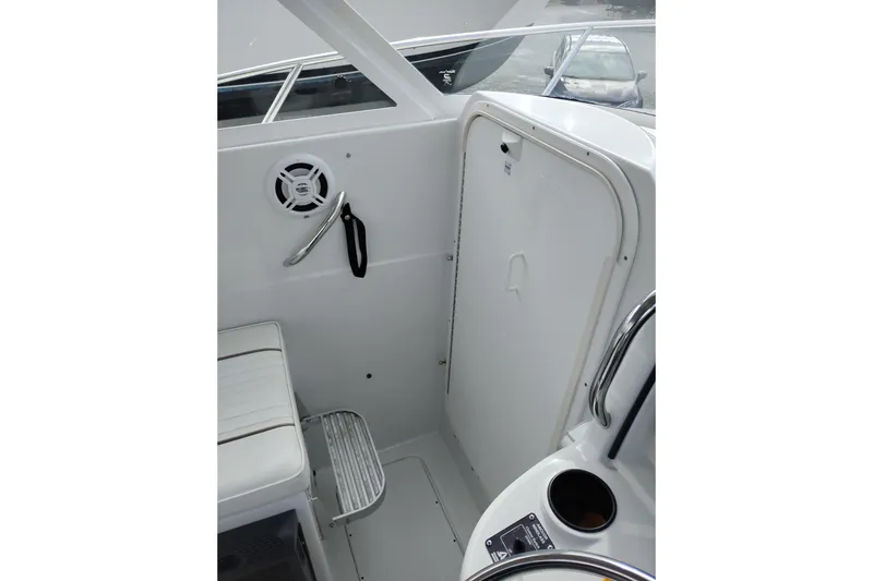 Slide: The Image of 2007 Glacier Bay 2685 Coastal Runner interior with seating and storage compartment. - 29