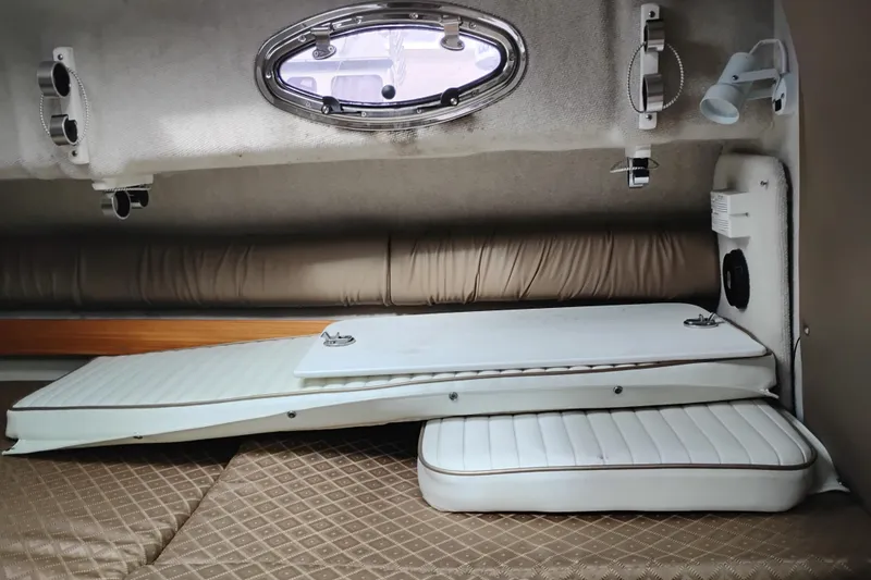 Slide: The Image of 2007 Glacier Bay 2685 Coastal Runner cabin interior with cushions and porthole. - 34