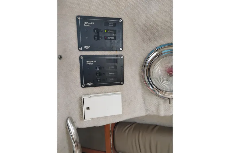 Slide: The Image of Breaker panels and light fixture on 2007 Glacier Bay 2685 Coastal Runner boat. - 38