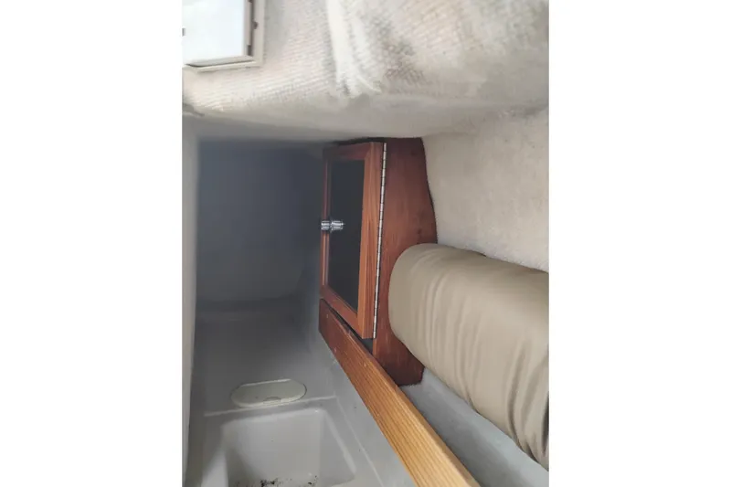 Slide: The Image of Interior cabin of 2007 Glacier Bay 2685 Coastal Runner with wooden cabinet and cushioned seating. - 39