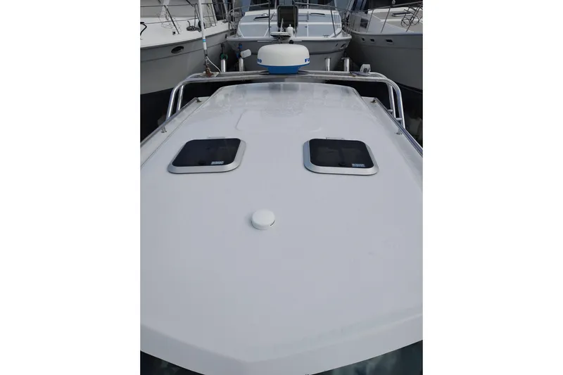 Slide: The Image of 2007 Glacier Bay 2685 Coastal Runner boat deck with hatches and radar. - 41