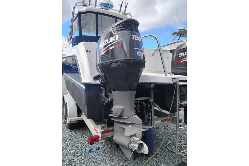 Slide: The Image of 2007 Glacier Bay 2685 Coastal Runner with Suzuki 150 outboard motor on trailer. - 5