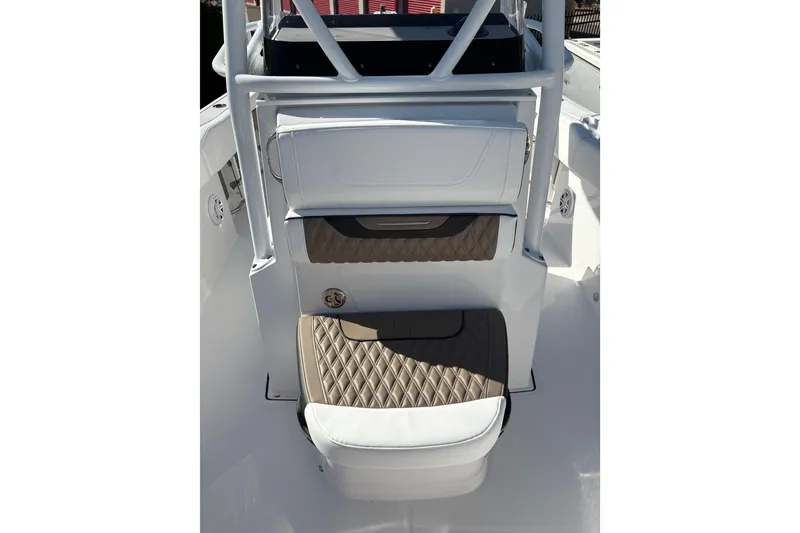 Slide: The Image of 2024 Blackfin 222CC boat interior with white and brown cushioned seating. - 12