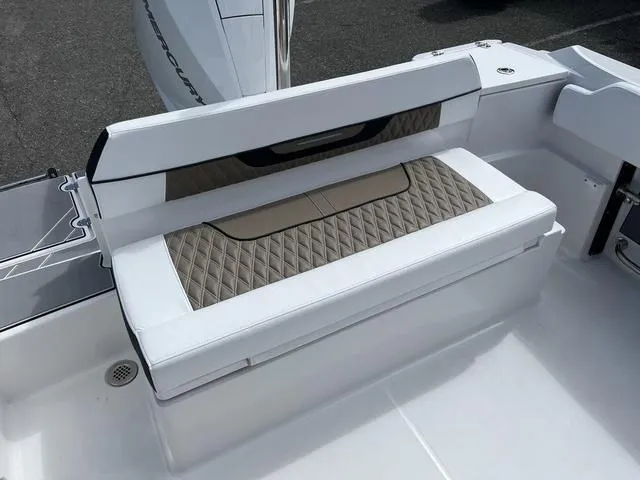 Slide: The Image of 2024 Blackfin 222CC boat seating with diamond-patterned upholstery and sleek design. - 22