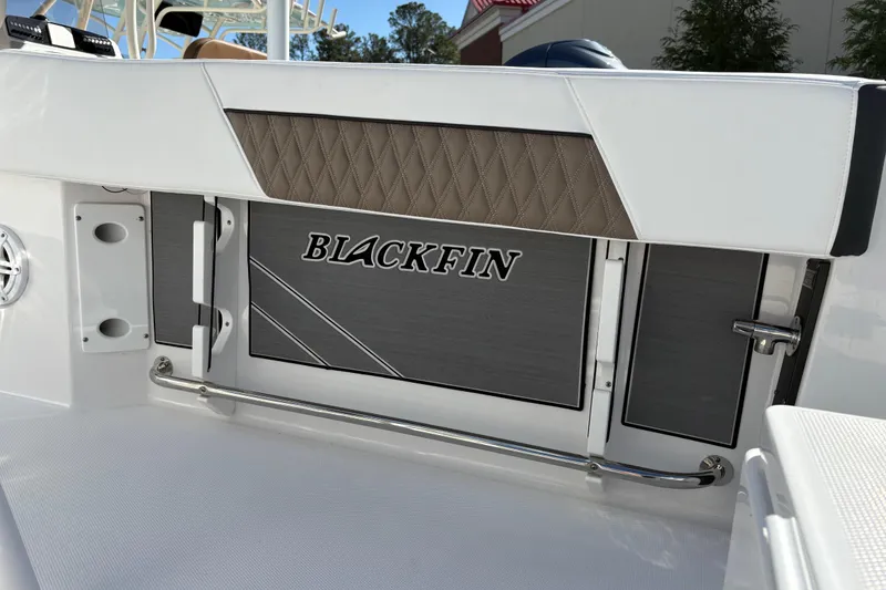 Slide: The Image of 2024 Blackfin 222CC boat interior with logo and sleek design details. - 23