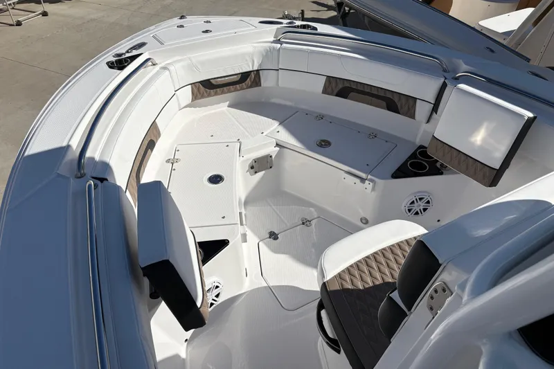 Slide: The Image of 2024 Blackfin 222CC boat interior with cushioned seating and storage compartments. - 6