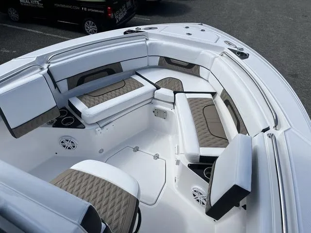 Slide: The Image of 2024 Blackfin 222CC boat interior with cushioned seating and modern design. - 7