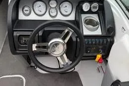 Slide: The Image of Dashboard of a 2015 Bryant 198 Walkabout boat with steering wheel and gauges. - 5