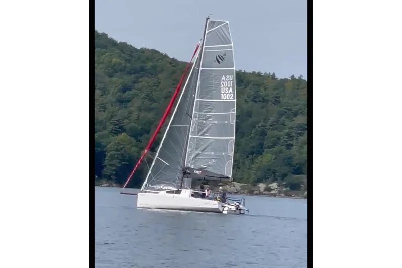 Slide: The Image of 2022 Beneteau First 24 SE sailboat on a calm lake - 4