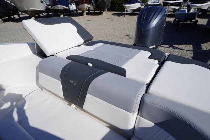 Slide: The Image of 2026 Chaparral 23 SSi OB boat interior with adjustable seating and outboard motor. - 57