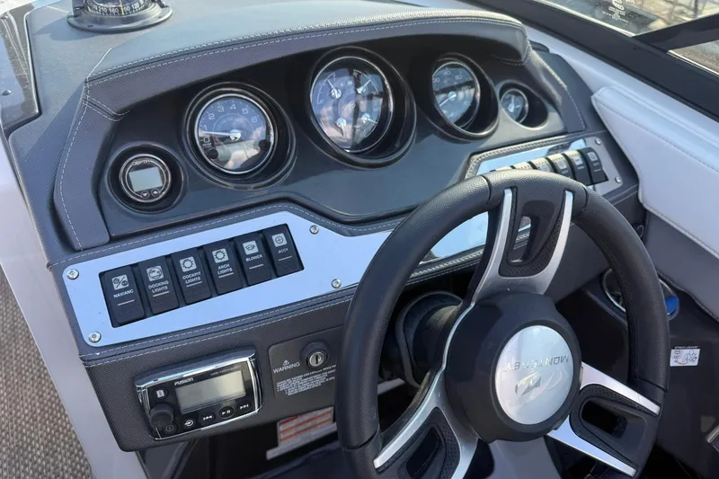 Slide: The Image of Dashboard of 2016 Monterey 258SS Super Sport boat with steering wheel and control panel. - 11