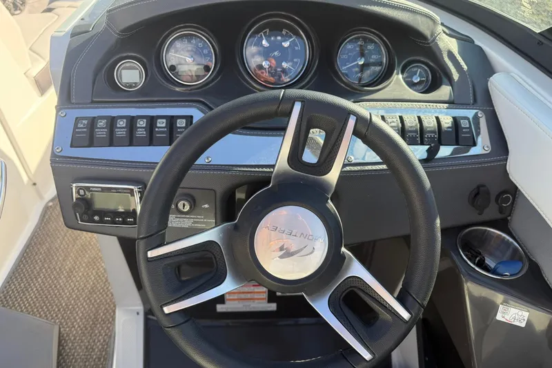 Slide: The Image of 2016 Monterey 258SS Super Sport dashboard with steering wheel and control panel. - 13