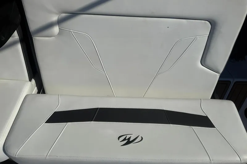 Slide: The Image of White leather seating on 2016 Monterey 258SS Super Sport boat, featuring sleek design and logo. - 14