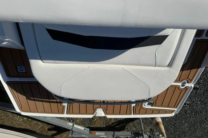 Slide: The Image of 2016 Monterey 258SS Super Sport boat with white seating and brown deck. - 15