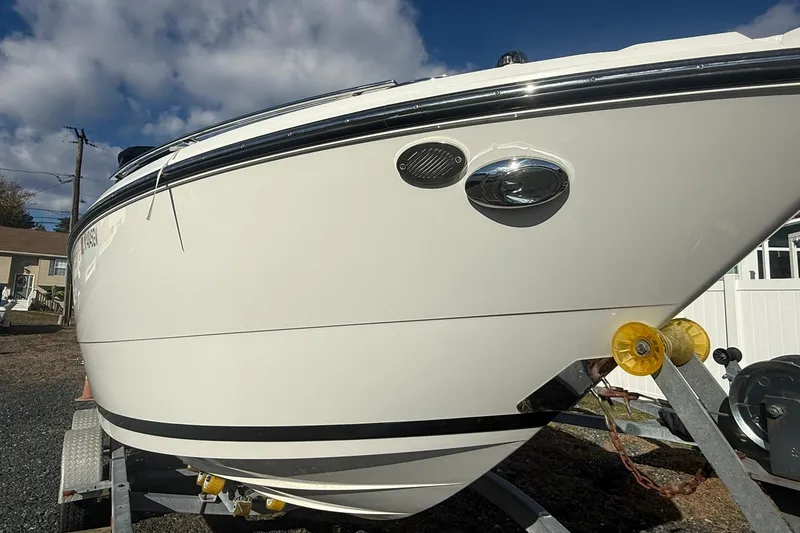 Slide: The Image of 2016 Monterey 258SS Super Sport boat on trailer under a cloudy sky. - 3