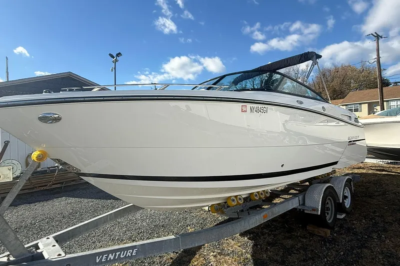 Slide: The Image of 2016 Monterey 258SS Super Sport boat on trailer under blue sky. - 4