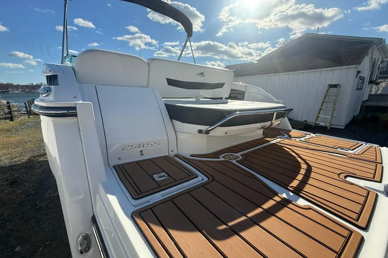 Slide: The Image of 2016 Monterey 258SS Super Sport boat with teak deck, docked under sunny skies. - 5