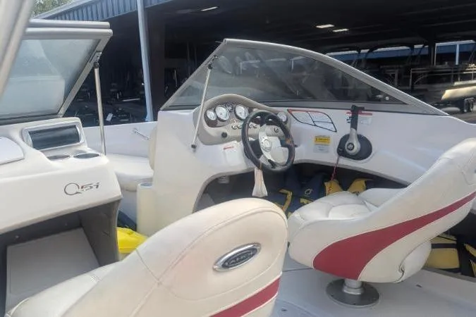Slide: The Image of 2011 Tahoe Q5L I/O boat interior with steering wheel and dashboard controls. - 16