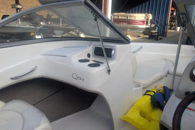 Slide: The Image of 2011 Tahoe Q5L I/O boat interior with seating and dashboard view. - 17