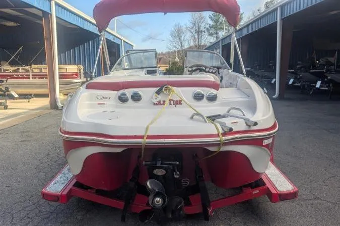 Slide: The Image of 2011 Tahoe Q5L I/O boat with red and white design in storage area. - 9