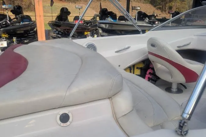 Slide: The Image of Interior of a 2011 Tahoe Q5L I/O boat with white and red seating. - 11