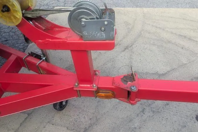 Slide: The Image of Red trailer hitch with winch, Tahoe Q5L I/O 2011 model, on concrete surface. - 15