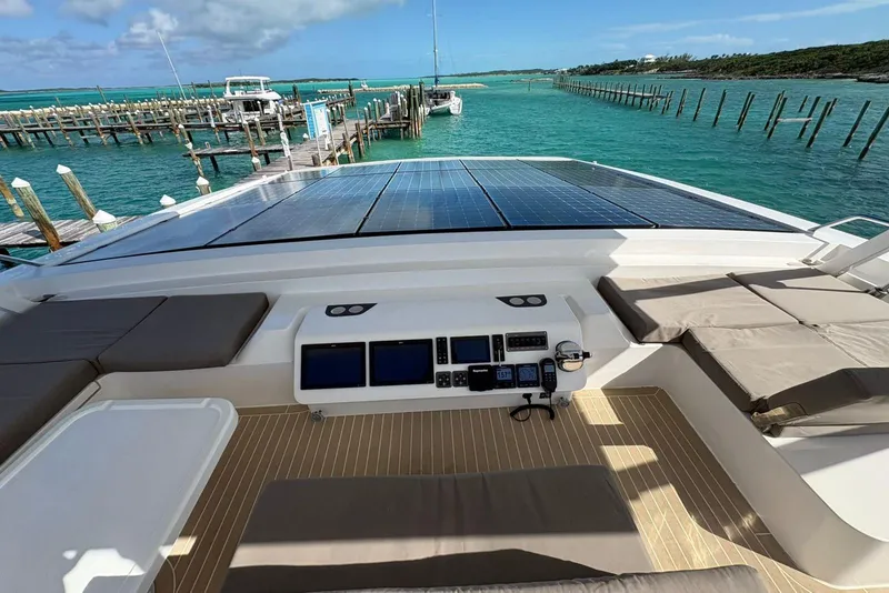 Slide: The Image of Silent 55 yacht with solar panels, docked in turquoise waters, 2020 model. - 11