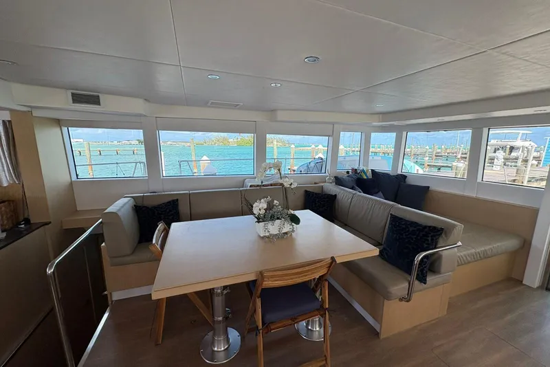 Slide: The Image of Luxurious interior of 2020 Silent 55 yacht with panoramic windows and elegant seating area. - 14