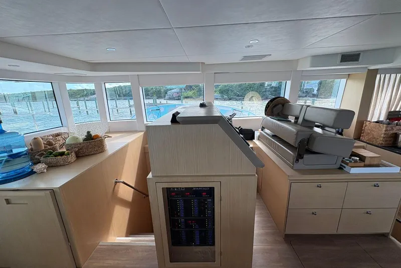 Slide: The Image of Interior of 2020 Silent 55 yacht with helm, seating, and panoramic windows. - 15