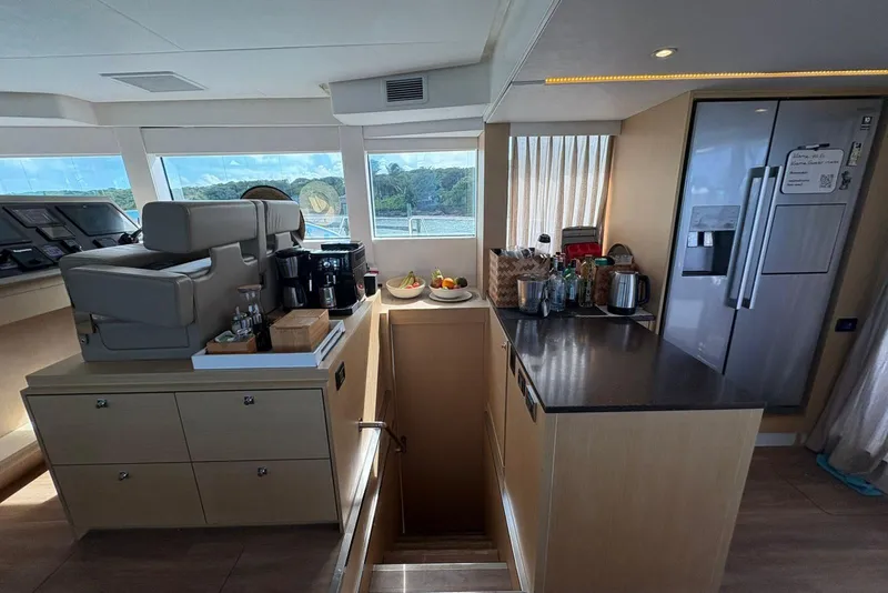 Slide: The Image of Modern kitchen interior on a 2020 Silent 55 yacht, featuring appliances and scenic views. - 18