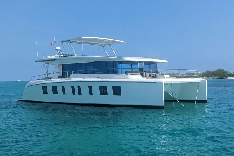 Slide: The Image of Silent 55 yacht, 2020 model, anchored in clear blue waters under a sunny sky. - 3