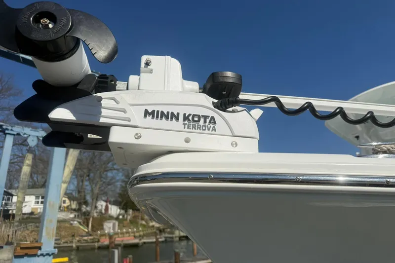 Slide: The Image of Minn Kota Terrova motor on 2021 Sea Hunt Ultra 229 boat, dockside view. - 17