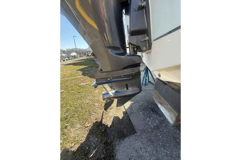 Slide: The Image of Outboard motor of 2021 Sea Hunt Ultra 229 boat on a sunny day. - 19