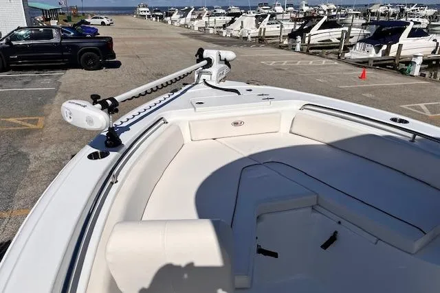 Slide: The Image of 2021 Sea Hunt Ultra 229 boat docked, featuring spacious seating and modern design. - 3