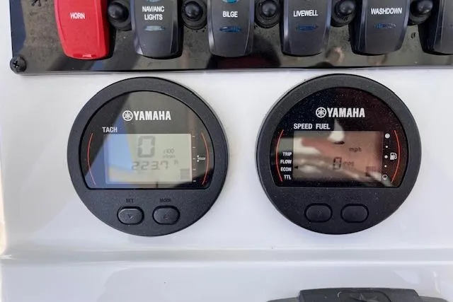 Slide: The Image of Yamaha gauges on 2021 Sea Hunt Ultra 229 boat dashboard, showing tachometer and speed fuel indicators. - 5