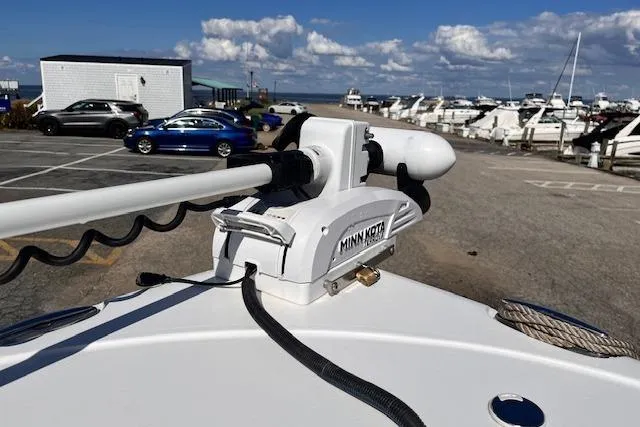Slide: The Image of 2021 Sea Hunt Ultra 229 with Minn Kota trolling motor at marina. - 6