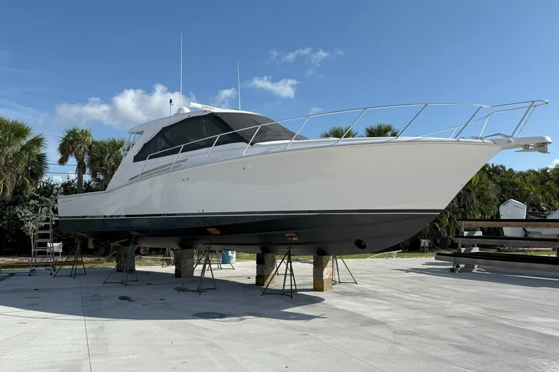 Slide: The Image of 2020 Hatteras GT45X yacht on dry dock under clear blue sky. - 1