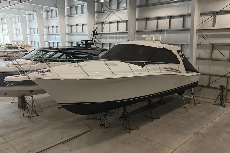 Slide: The Image of 2020 Hatteras GT45X yacht in indoor storage, side view. - 12