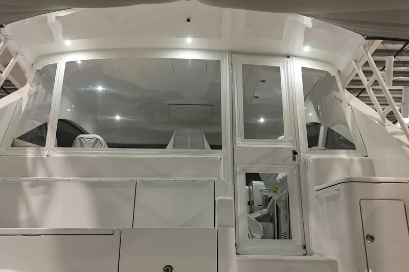 Slide: The Image of 2020 Hatteras GT45X yacht interior view with sleek white design. - 21