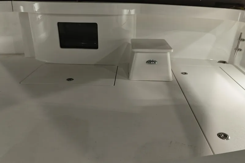 Slide: The Image of 2020 Hatteras GT45X boat deck with storage compartments and sleek design. - 24