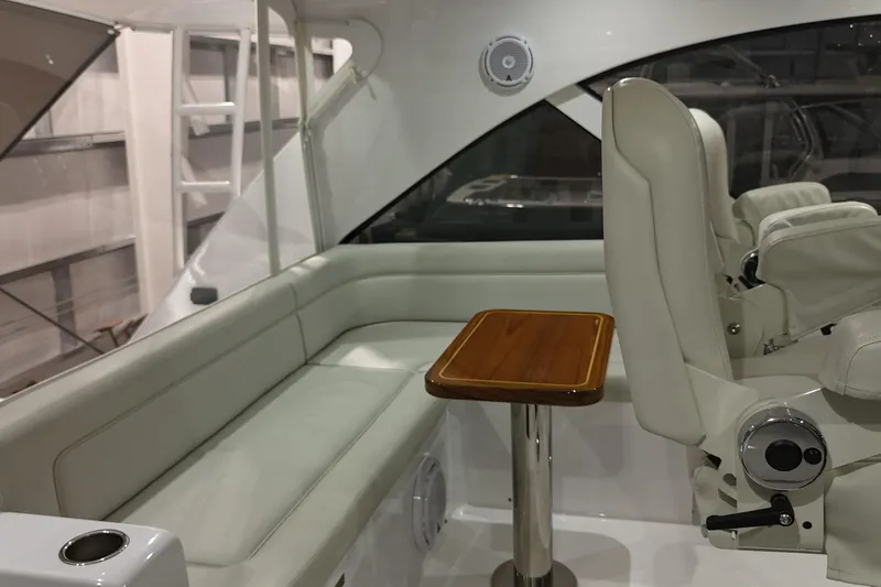 Slide: The Image of Interior of 2020 Hatteras GT45X yacht with white seating and wooden table. - 29