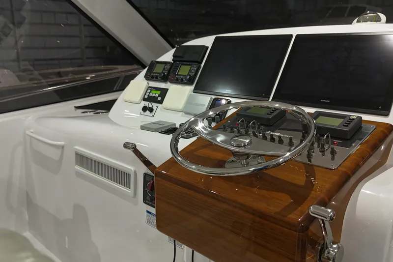 Slide: The Image of Helm of 2020 Hatteras GT45X yacht with advanced navigation systems and controls. - 35