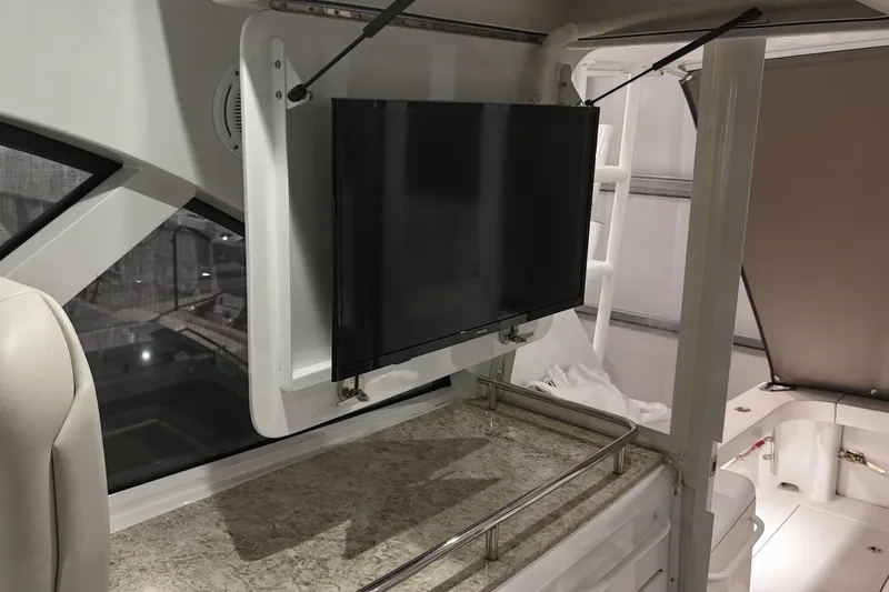 Slide: The Image of 2020 Hatteras GT45X yacht interior with mounted TV and countertop. - 41