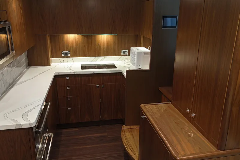 Slide: The Image of Luxurious 2020 Hatteras GT45X yacht interior with modern kitchen design. - 43