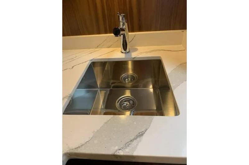 Slide: The Image of Stainless steel sink on Hatteras GT45X 2020 yacht with marble countertop. - 50